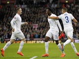 England's striker Danny Welbeck (C) celebrates after scoring his team's second goal during the Euro 2016 Qualifier, Group E football match against Slovenia on November 15, 2014