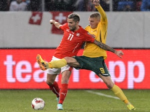Lithuania's forward Deivydas Matulevicius (R) and Switzerland's midfielder Valon Behrami vies for the ball during an Euro 2016 Group E qualifying match on November 15, 2014