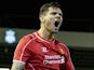Liverpool's Croatian defender Dejan Lovren celebrates scoring his team's second goal in the League Cup Fourth Round football match against Swansea City on November 13, 2014