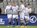 Denmark's defender Simon Kjaer celebrates with his teammates after scoring a goal during the Euro 2016 group I qualifying football match between Serbia and Denmark in Belgrade on November 14, 2014