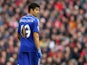Diego Costa of Chelsea looks on with a ripped shirt during the Barclays Premier League match between Liverpool and Chelsea at Anfield on November 8, 2014