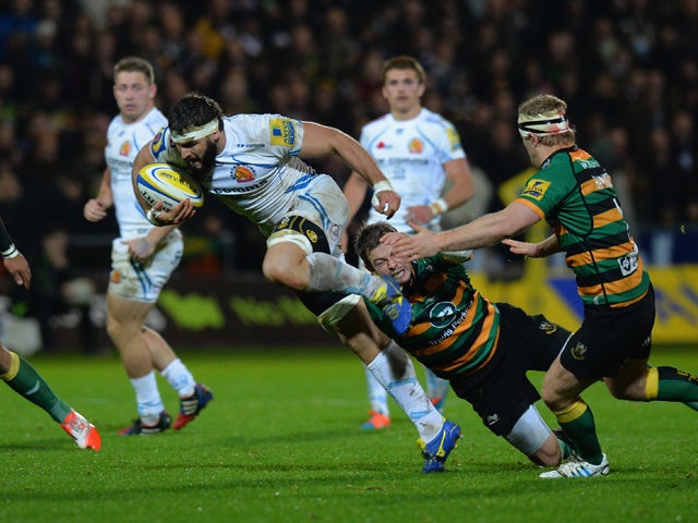 Stephen Myler of Northampton Saints tackles Don Armand of Exeter Chiefs during the Aviva Premiership match between Northampton Saints and Exeter Chiefs at Franklin's Gardens on November 14, 2014