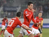 Switzerland's defender Fabian Schaer (2ndR) celebrates after scoring the team's second goal during the Euro 2016 Group E qualifying match against Lithuania on November 15, 2014