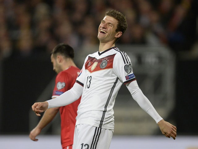 Germany's striker Thomas Muller laughs after the first goal during the UEFA 2016 European Championship qualifying round Group D football match Germany vs Gibraltar in Nuremberg, southern Germany on November 14, 2014