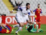 Cypriot player Giorgos Merkis (C) celebrates scoring a goal during their Euro 2016 Group B qualifying match against Andorra at the GSP Stadium in the capital Nicosia on November 16, 2014