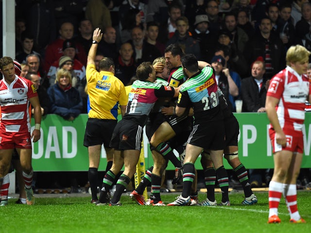 Harlequins celebrate their last minute try during the Aviva Premiership match between Gloucester Rugby and Harlequins at Kingsholm Stadium on November 14, 2014