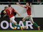 Hungary's midfielder Zoltán Gera celebrates scoring a goal with Hungary's midfielder Balazs Dzsudzsak (L) during the UEFA 2016 European Championship qualifying round Group F football match Hungary vs Finland at the Groupama Arena stadium in Budapest on