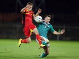 Belgium's Jinty Canepeel and Northern Ireland's Jamie Harney vie for the ball during the Euro 2014 U19 qualifying football match between Belgium and Northern Ireland on October 10, 2013