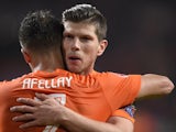 Dutch player Klaas-Jan Huntelaar celebrates with teammate Ibrahim Afellay after scoring during the Euro 2016 qualifying round football match against Latvia on November 16, 2014