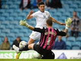 Alex Mowatt of Leeds United has his shot saved by Keiren Westwood of Sheffield Wednesday during the Sky Bet Championship match between Leeds United and Sheffield Wednesday at Elland Road on October 4, 2014