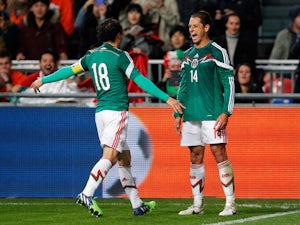 Half-Time Report: Hernandez penalty hands Mexico lead