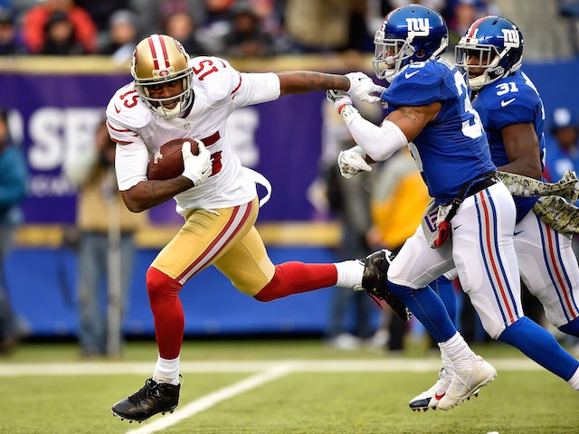 Michael Crabtree #15 of the San Francisco 49ers breaks free from Quintin Demps #35 of the New York Giants on his way to scoring a touchdown on November 16, 2014