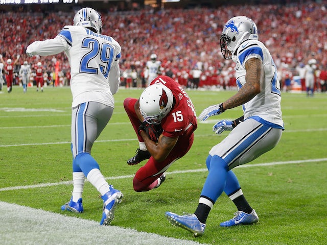 Wide receiver Michael Floyd #15 of the Arizona Cardinals catches the football to make 42 yard touchdown during first quarter of the NFL game against the Detroit Lions on November 16, 2014