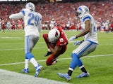 Wide receiver Michael Floyd #15 of the Arizona Cardinals catches the football to make 42 yard touchdown during first quarter of the NFL game against the Detroit Lions on November 16, 2014