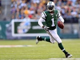 Quarterback Michael Vick #1 of the New York Jets carries the ball against the Pittsburgh Steelers during a game at MetLife Stadium on November 9, 2014