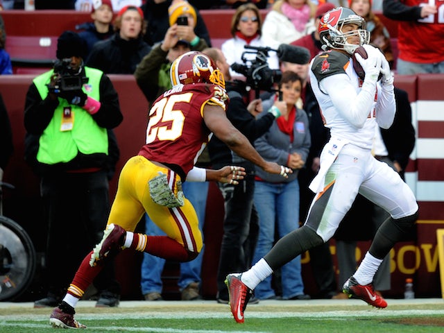 Wide receiver Mike Evans of the Tampa Bay Buccaneers makes a 3rd quarter touchdown catch over the free safety Ryan Clark of the Washington Redskins on November 16, 2014