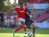 Nathan Thompson of Swindon in action with Sam McQueen of Southampton during the Pre Season Friendly between Swindon Town and Southampton on July 21, 2014