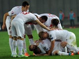 Poland's players celebrate after scoring during the UEFA Euro 2016 qualifying Group D football match Georgia vs Poland in Tbilisi on November 14, 2014