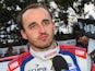 Robert Kubica of Poland talks to the media during Day Two of the WRC Australia on September 13, 2014