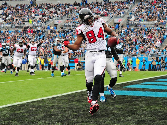 Roddy White #84 of the Atlanta Falcons celebrates after making a catch for a third quarter touchdown against the Carolina Panthers on November 16, 2014