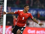 Austria's Rubin Okotie celebrates after scoring a goal during the UEFA 2016 European Championship qualifying round Group G football match against Russia on November 15, 2014