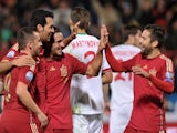 Spain's midfielder Sergio Busquets (2L) celebrates after scoring against Belraus during the UEFA Euro 2016 qualifying football match against Belarus on November 15, 2014