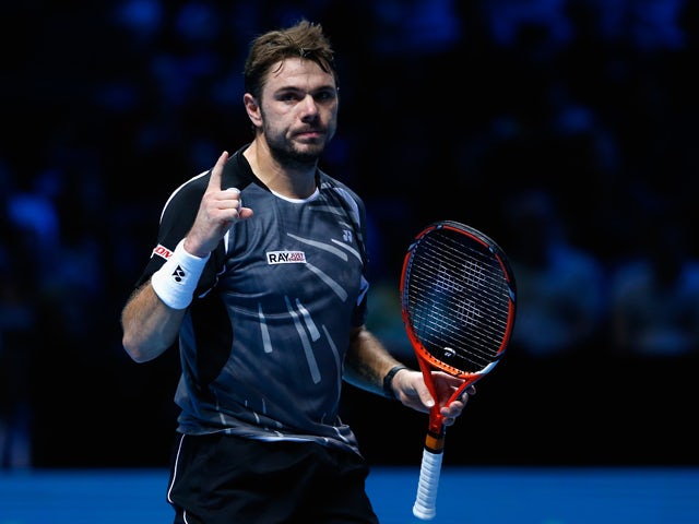 Stan Wawrinka of Switzerland celerates defeating Tomas Berdych of Czech Republic in the round robin during day two of the Barclays ATP World Tour Finals tennis at the O2 Arena on November 10, 2014 
