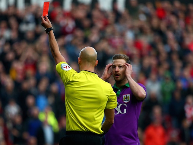 Wade Elliott of Bristol City reacts as is sent off by referee Darren Drysdale during the Sky Bet League One match against Swindon Town on November 15, 2014