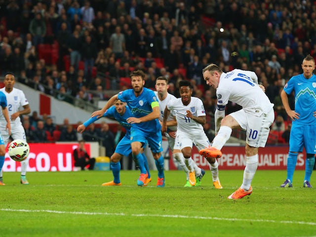 Wayne Rooney of England scores their first and equalising goal from a penalty during the EURO 2016 Qualifier Group E match between England and Slovenia on November 15, 2014