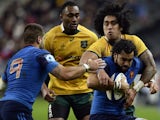 France's winger Yoann Huget (R) is tackled by Australia's winger Joseph Tomane during the international rugby union Test match on November 15, 2014