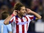 Atletico Madrid's Italian midfielder Alessio Cerci celebrates after scoring their fifth goal during the UEFA Champions League football match against Malmo on November 19, 2014
