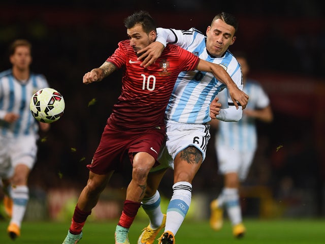 Danny of Portugal and Nicolas Otamendi of Argentina battle for the ball during the International Friendly between Argentina and Portugal at Old Trafford on November 18, 2014