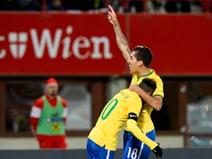 Brazil's forward Neymar and Brazil's midfielder Firmino celebrates scoring during a friendly football match Austria vs Brazil at the Ernst Happel Stadium in Vienna on November 18, 2014
