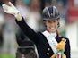 Gold medalist British Charlotte Dujardin celebrates on the podium on August 29, 2014 during the medal ceremony of the Individual Freestyle Dressage Grand Prix of the 2014 FEI World Equestrian Games