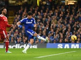 Diego Costa of Chelsea scores the opening goal under pressure from Joleon Lescott of West Brom during the Barclays Premier League match between Chelsea and West Bromwich Albion at Stamford Bridge on November 22, 2014