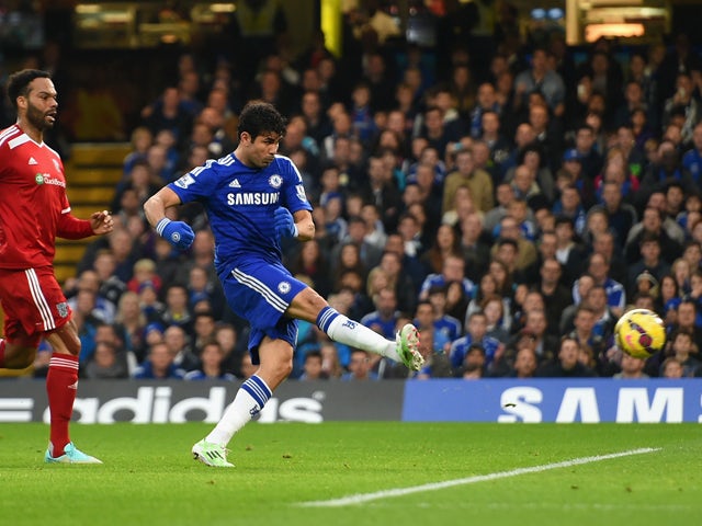 Diego Costa of Chelsea scores the opening goal under pressure from Joleon Lescott of West Brom during the Barclays Premier League match between Chelsea and West Bromwich Albion at Stamford Bridge on November 22, 2014