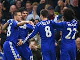 Diego Costa of Chelsea celebrates scoring opening goal with team mates during the Barclays Premier League match between Chelsea and West Bromwich Albion at Stamford Bridge on November 22, 2014
