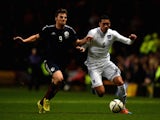 Chris Martin of Scotland and Chris Smalling of England compete for the ball during the International Friendly match on November 19, 2014