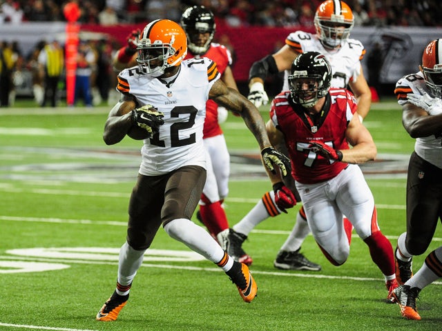 Josh Gordon #12 of the Cleveland Browns runs after a catch in the first half against the Atlanta Falcons at Georgia Dome on November 23, 2014