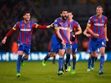 Mile Jedinak of Crystal Palace celebrates scoring his team's third goal with team mates during the Barclays Premier League match between Crystal Palace and Liverpool at Selhurst Park on November 23, 2014