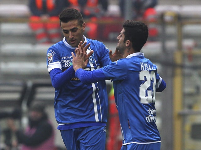 Matias Vecino of Empoli FC celebrates with his team-mate Elseid Hysaj after scoring the opening goal during the Serie A match between Parma FC and Empoli FC at Stadio Ennio Tardini on November 23, 2014 