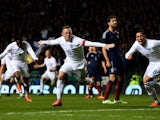 Wayne Rooney of England celebrates after scoring his team's second goal during the International Friendly match between Scotland and England at Celtic Park Stadium on November 18, 2014 