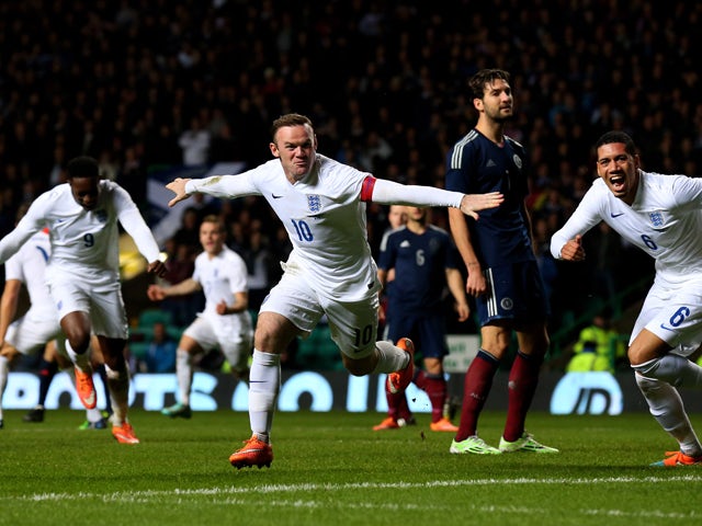 Wayne Rooney of England celebrates after scoring his team's second goal during the International Friendly match between Scotland and England at Celtic Park Stadium on November 18, 2014 