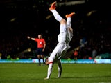 Wayne Rooney of England celebrates after scoring his team's third goal during the International Friendly match between Scotland and England at Celtic Park Stadium on November 18, 2014 