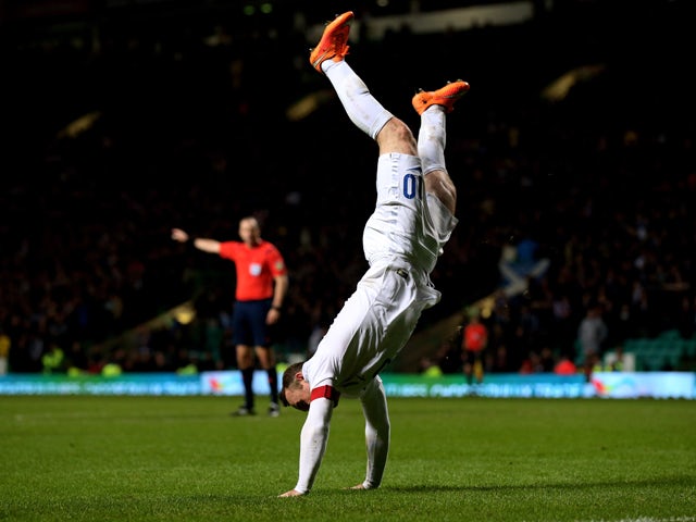 Wayne Rooney of England celebrates after scoring his team's third goal during the International Friendly match between Scotland and England at Celtic Park Stadium on November 18, 2014 