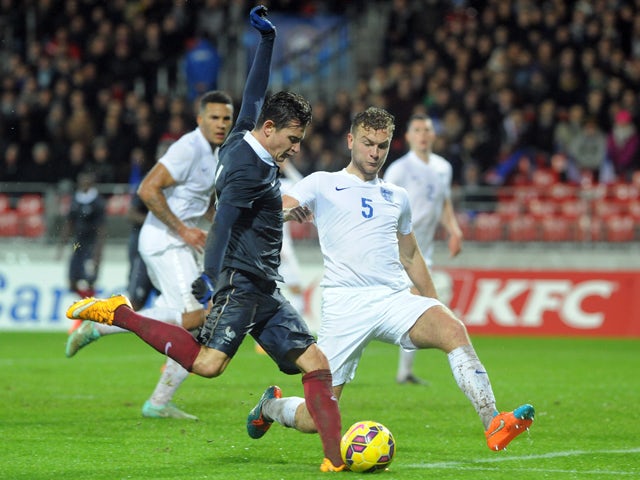 France forward Florian Thauvin fights for the ball with England defender Ben Gibson on November 17, 2014 
