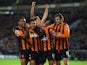 Jake Livermore of Hull City is mobbed by team mates after scoring the opening goal during the Barclays Premier League match between Hull City and Tottenham Hotspur at KC Stadium on November 23, 2014