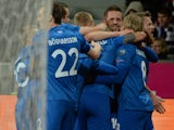 Iceland's players celebrate after scoring 0-1 during the UEFA 2016 European Championship qualifying round Group A football match Czech Republic vs Iceland at the Doosan Arena stadium in Pilsen on November 16, 2014