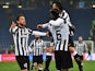 Juventus' midfielder from France Paul Pogba is congratulated by Juventus' midfielder Claudio Marchisio and Juventus' forward from Argentina Carlos Tevez during the Italian Serie A football match between Lazio Rome and Juventus on November 22, 2014