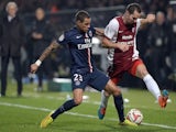 Metz' French midfielder Kevin Lejeune (R) vies with Paris Saint-Germain's Dutch defender Gregory Van der Wiel, during the French L1 football match on November 21, 2014